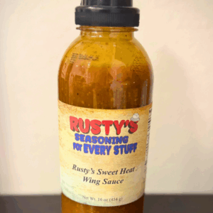 a bottle of Rusty's Seasoning For Every Stuff Rusty's Sweet Heat Wing Sauce
